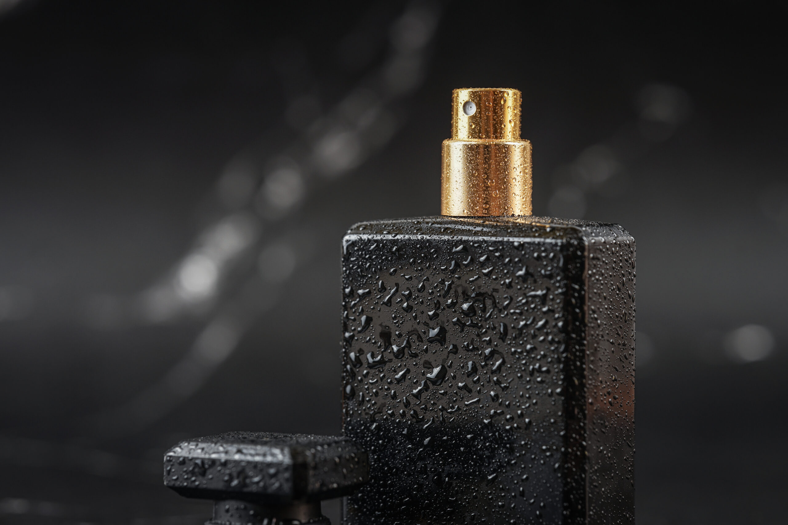 beautiful perfume bottle black marble background